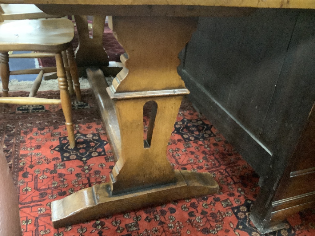 A modern kitchen refectory table, and three wheel back dining chairs (4)